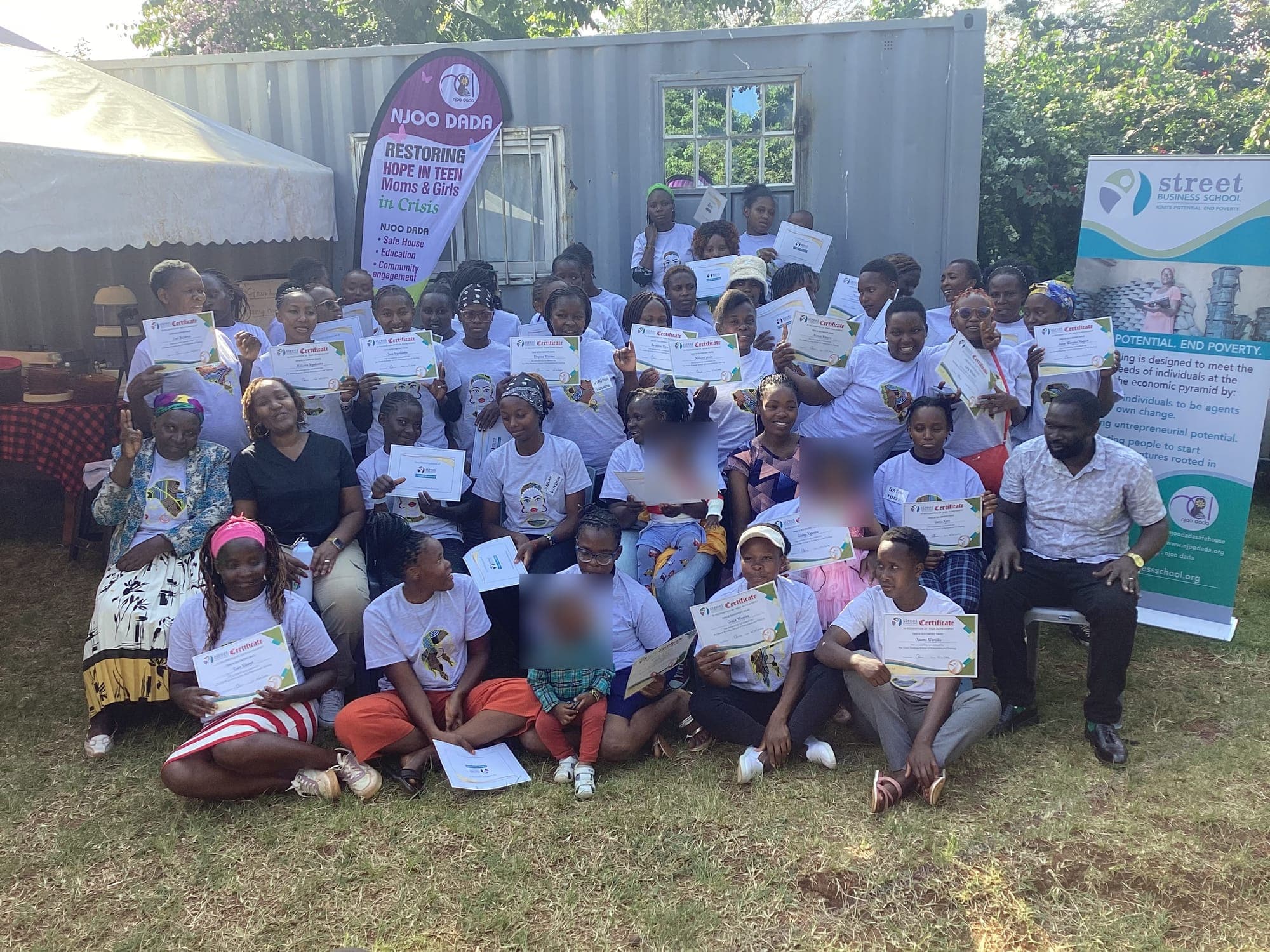 Njoo Dada participants celebrating with their Street Business School graduation certificates.